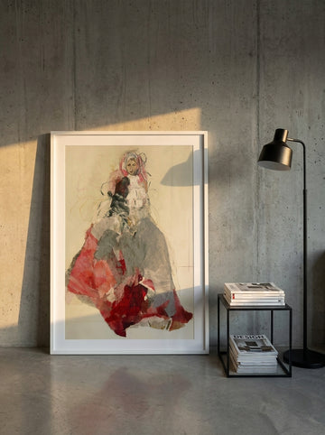 Oversized statement modern wall art print leaning against the wall in an industrial loft living room