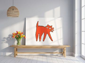 Modern wall art print standing on a bench in a bright Scandinavian living room