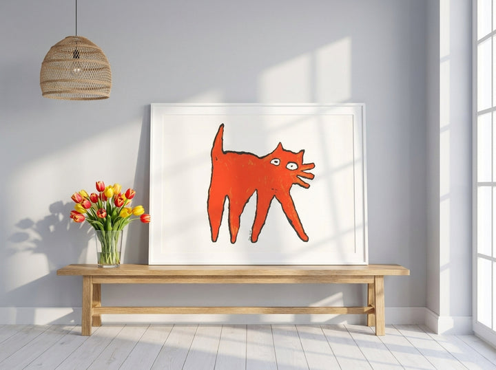 Modern wall art print standing on a bench in a bright Scandinavian living room