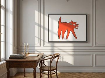 Canvas wall art with a white surround styled on the wall in a Parisian home office