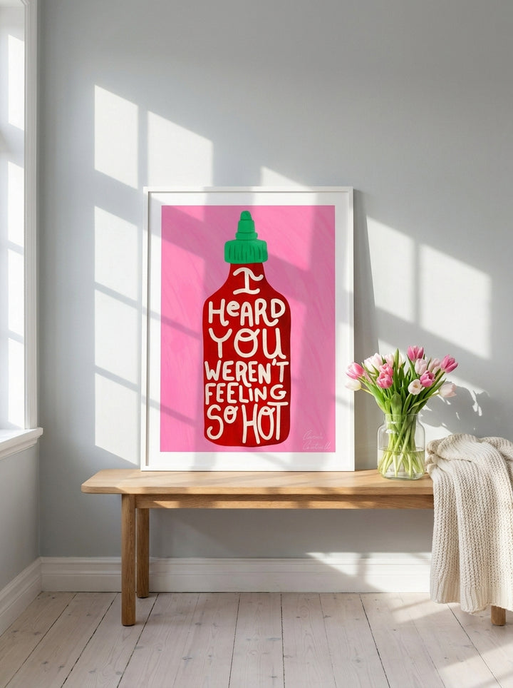 Modern wall art print standing on a bench in a bright Scandinavian dining room