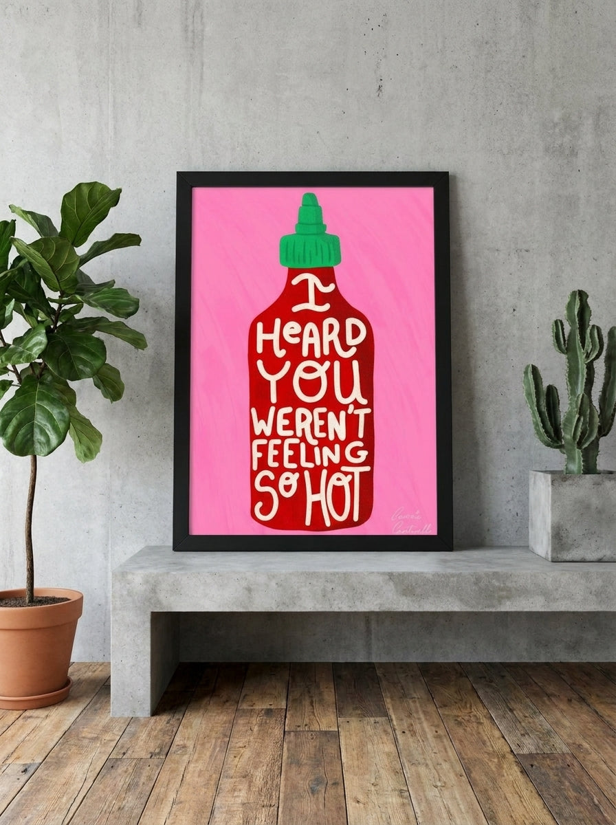 Modern wall art print standing on a kitchen bench in an industrial loft kitchen