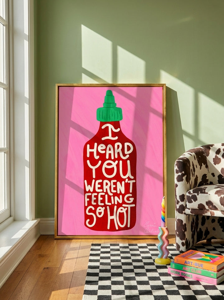 Canvas wall art with a gold leaf surround leaning against the wall in a colourful eclectic dining room