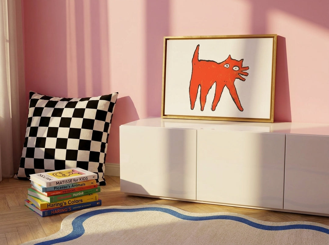 Canvas wall art with a gold leaf surround standing on a sideboard in a colourful eclectic nursery
