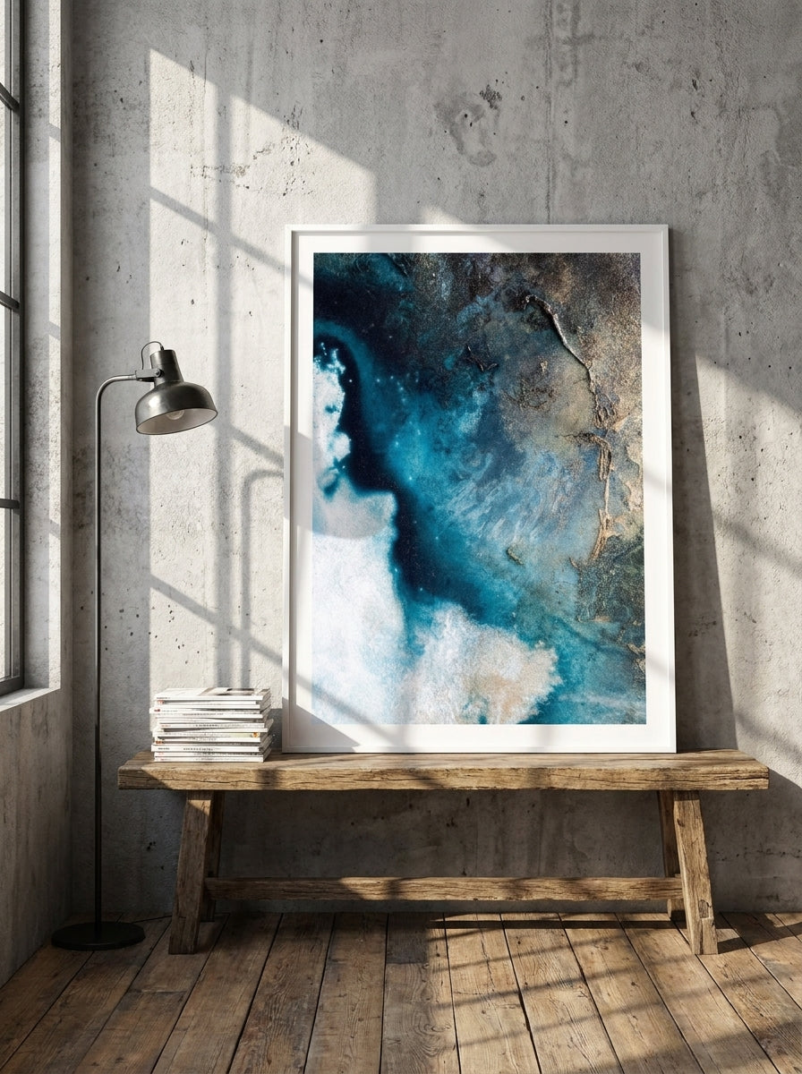 Modern wall art print standing on a bench in an industrial loft bedroom