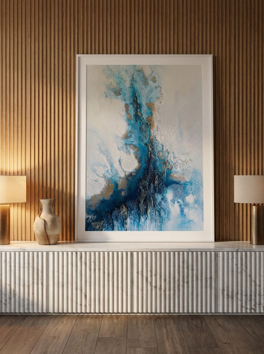 Modern wall art print standing on a sideboard in a luxe home office