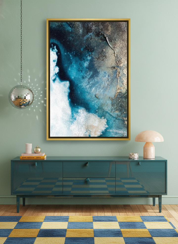 Oversized statement canvas wall art with a gold leaf surround styled on the wall in a colourful eclectic living room