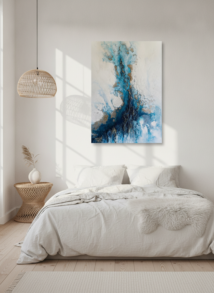 Stretched canvas wall art styled on the wall in a bright Scandinavian bedroom