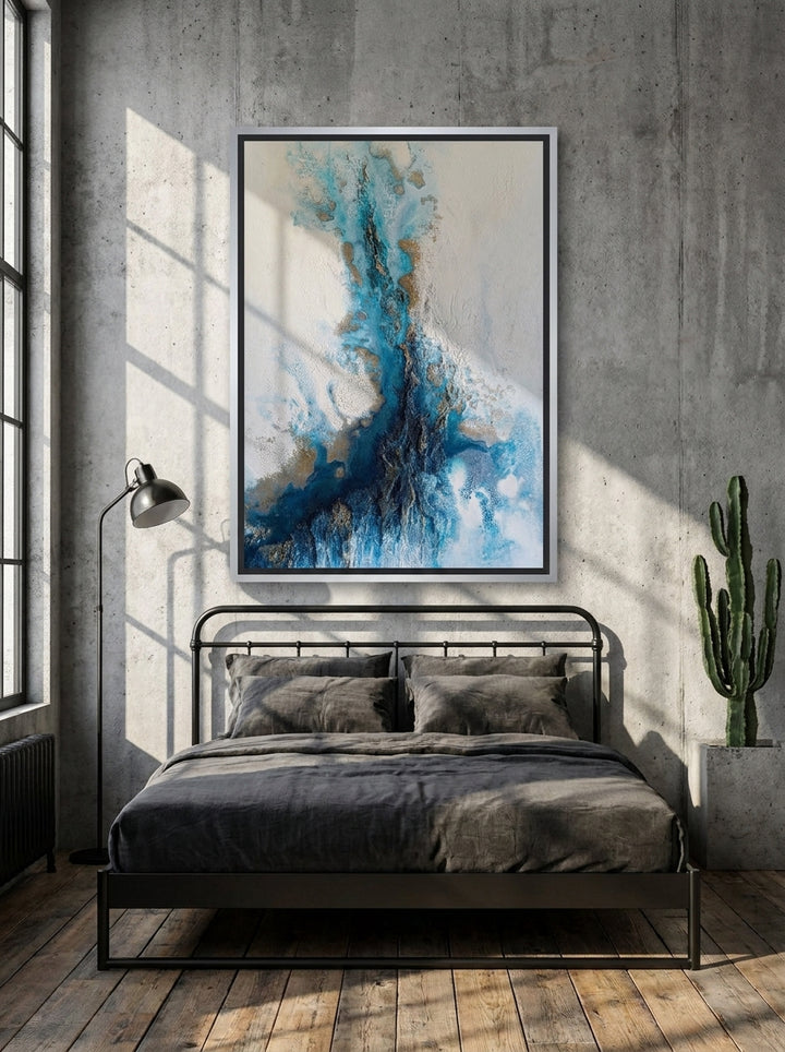 Canvas wall art with a silver leaf surround styled on the wall in an industrial loft bedroom