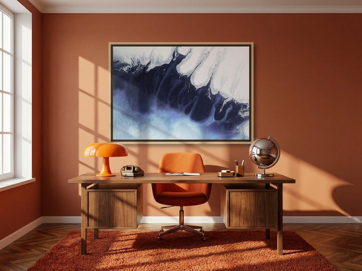Canvas wall art with a natural timber surround styled on the wall in a retro 70s home office