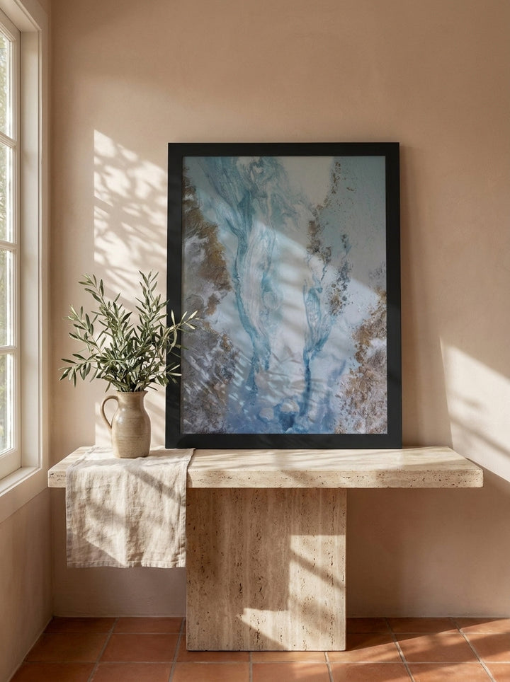 Modern wall art print standing on a console in a Mediterranean bathroom