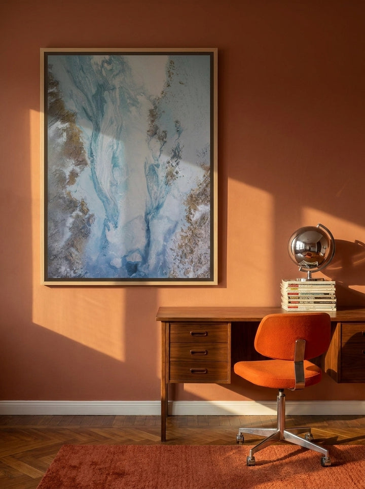 Canvas wall art with a natural timber surround styled on the wall in a retro 70s home office