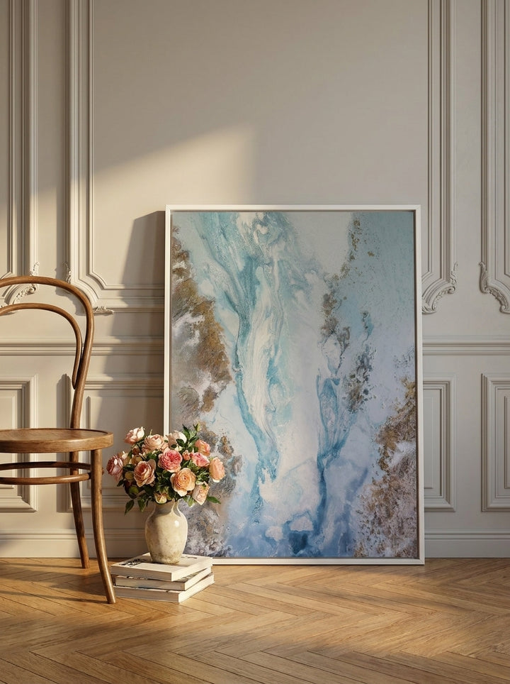 Canvas wall art with a white surround leaning against the wall in a Parisian bathroom