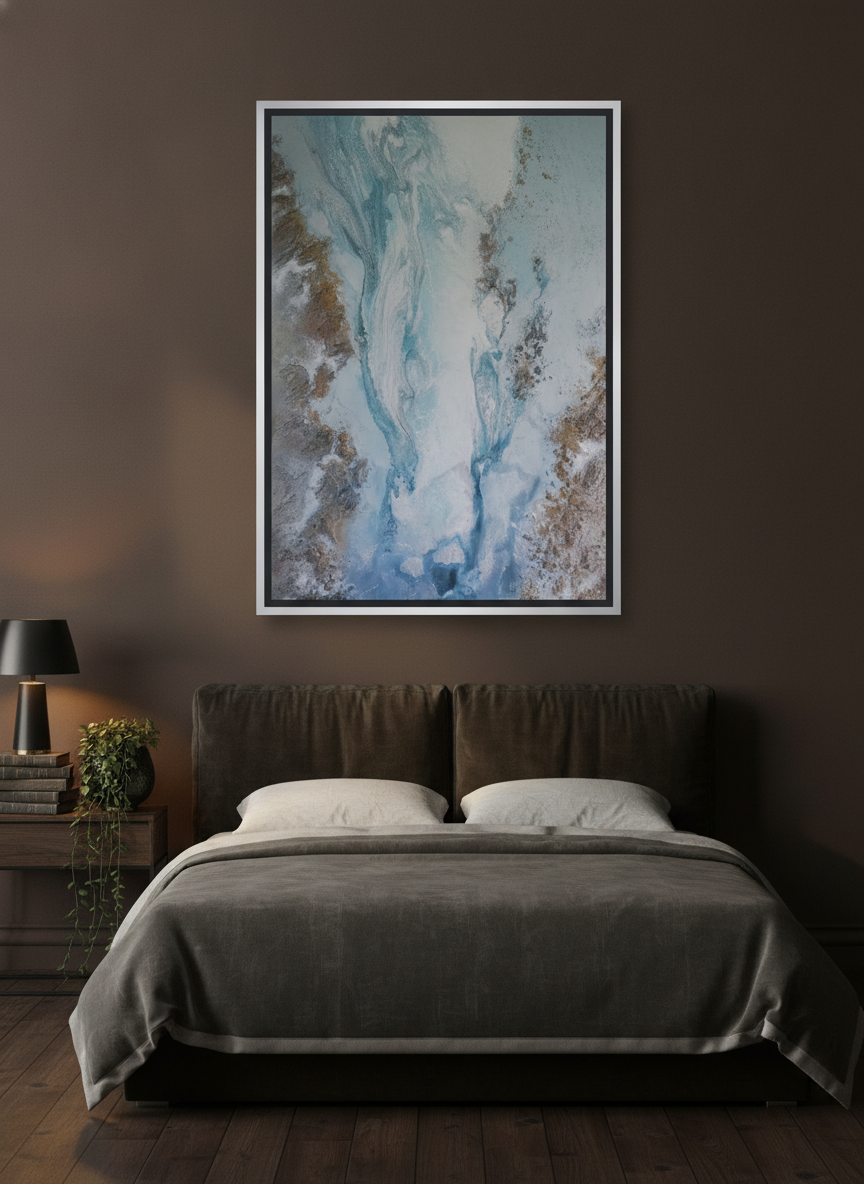 Canvas wall art with a silver leaf surround styled on the wall in a moody bedroom