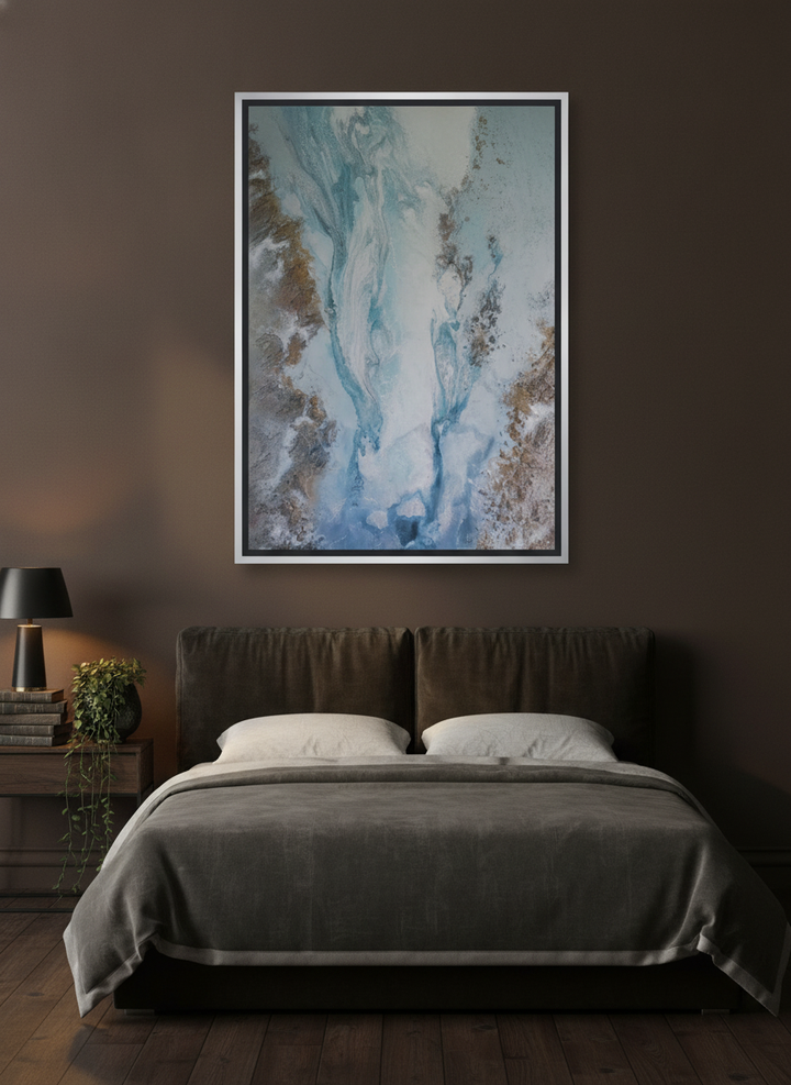 Canvas wall art with a silver leaf surround styled on the wall in a moody bedroom