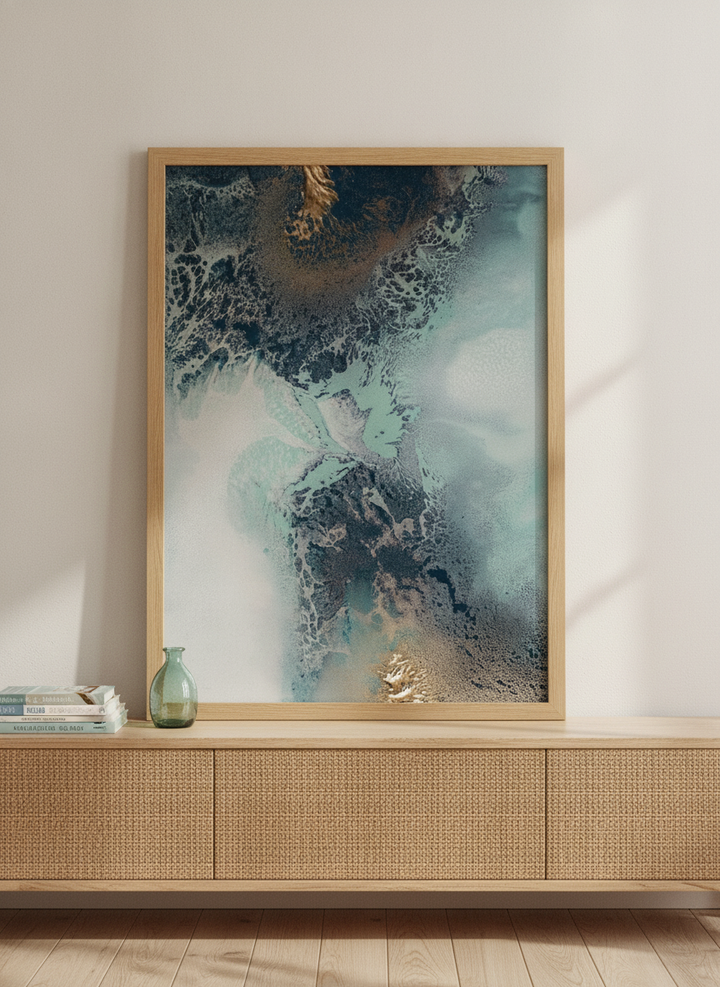 Modern wall art print standing on a sideboard in a coastal home office