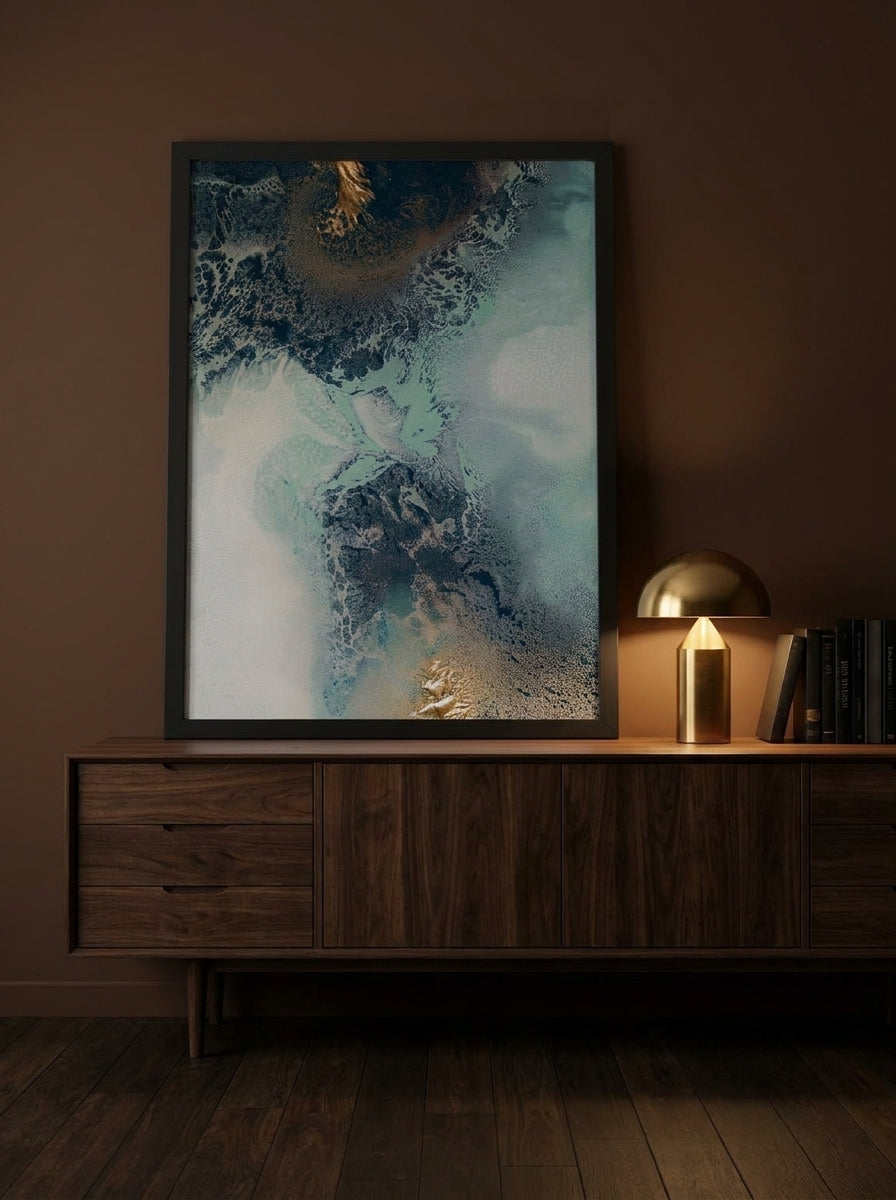 Modern wall art print standing on a sideboard in a moody bedroom
