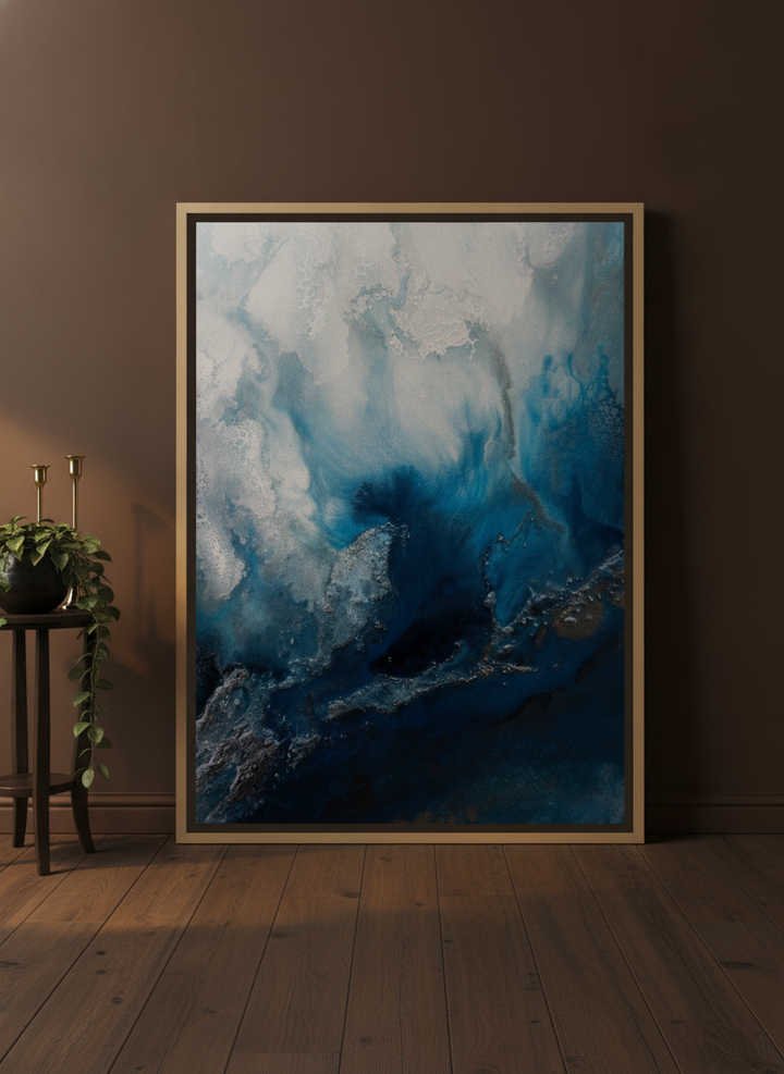 Oversized statement canvas wall art with a natural timber surround leaning against the wall in a moody living room