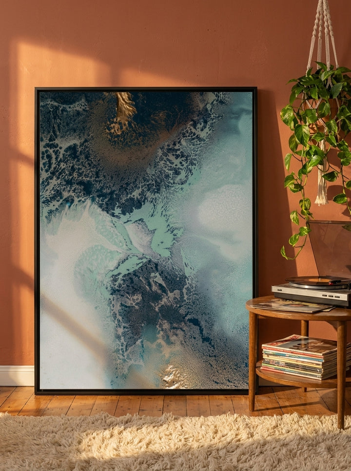 Oversized statement canvas wall art with a black surround leaning against the wall in a retro 70s living room