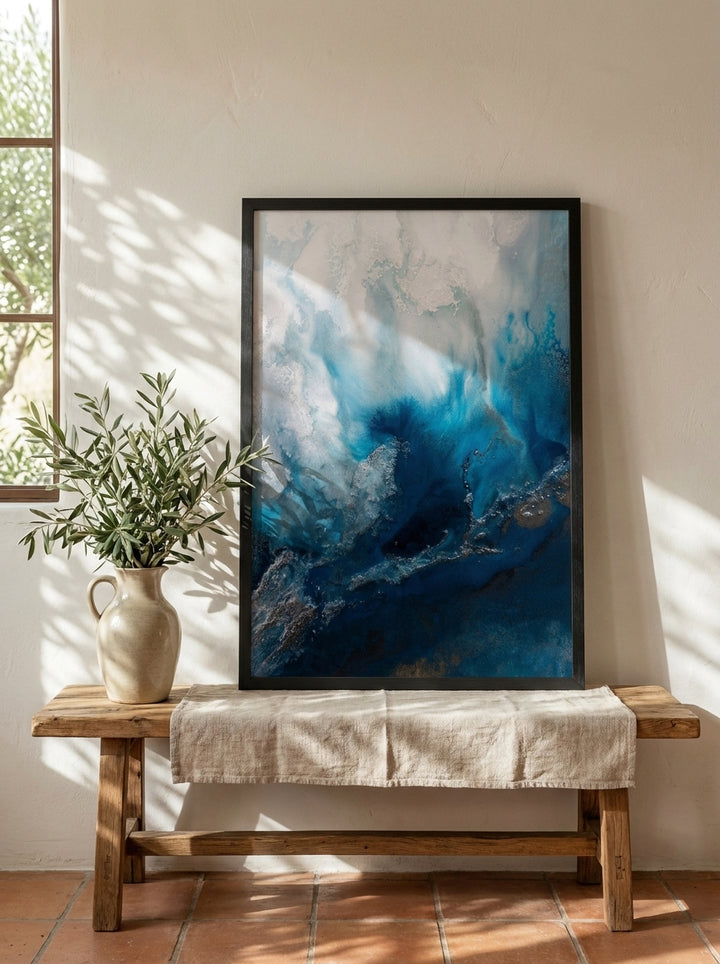 Modern wall art print standing on a bench in a Mediterranean home office