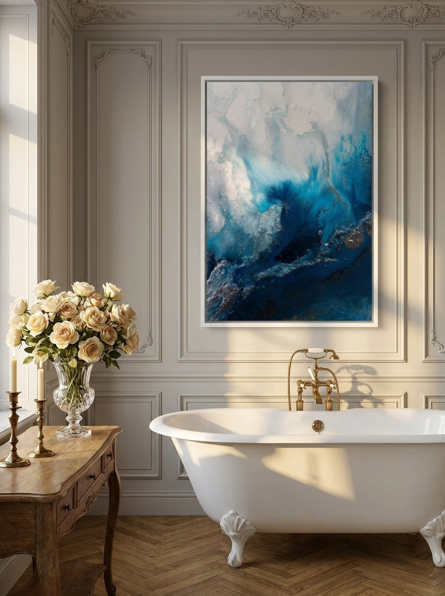 Canvas wall art with a white surround styled on the wall in a Parisian bathroom
