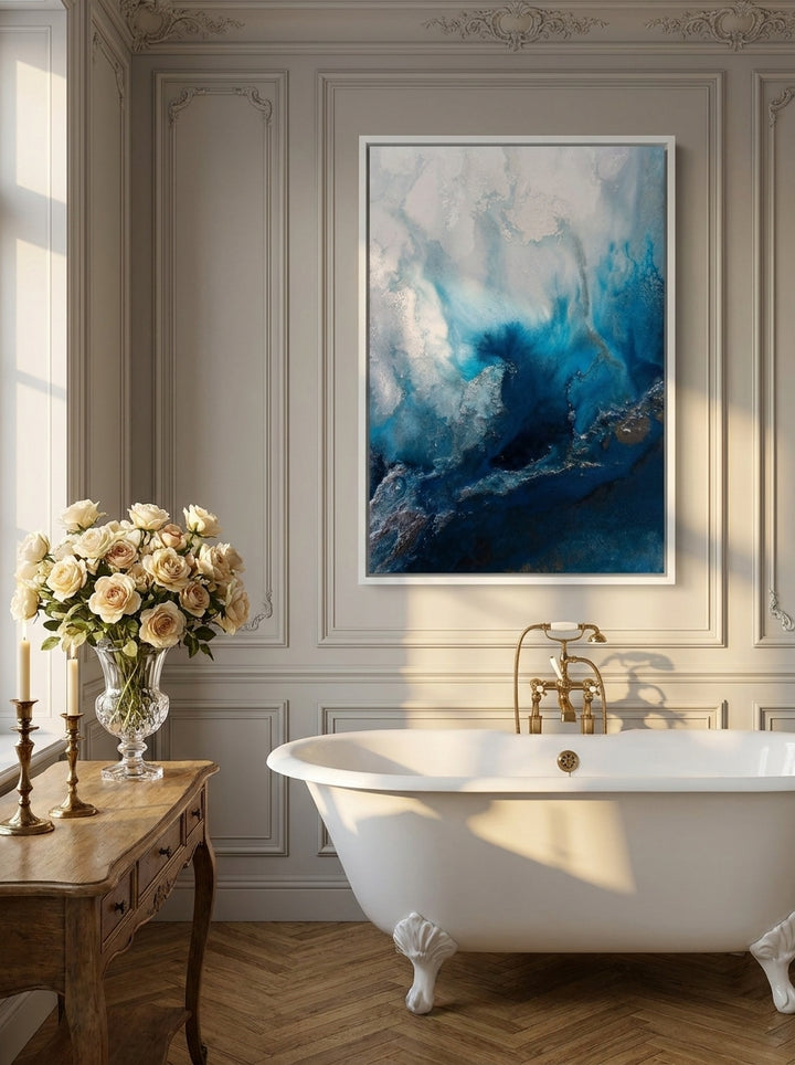 Canvas wall art with a white surround styled on the wall in a Parisian bathroom