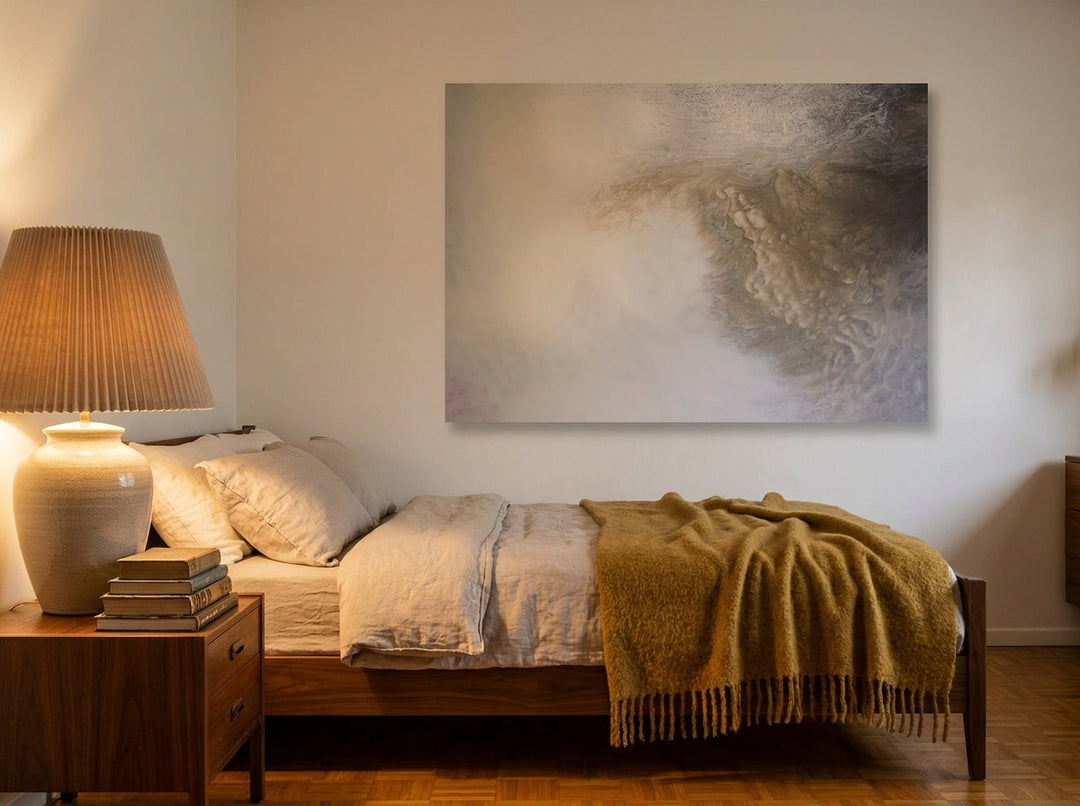 Stretched canvas wall art styled on the wall in a mid-century bedroom