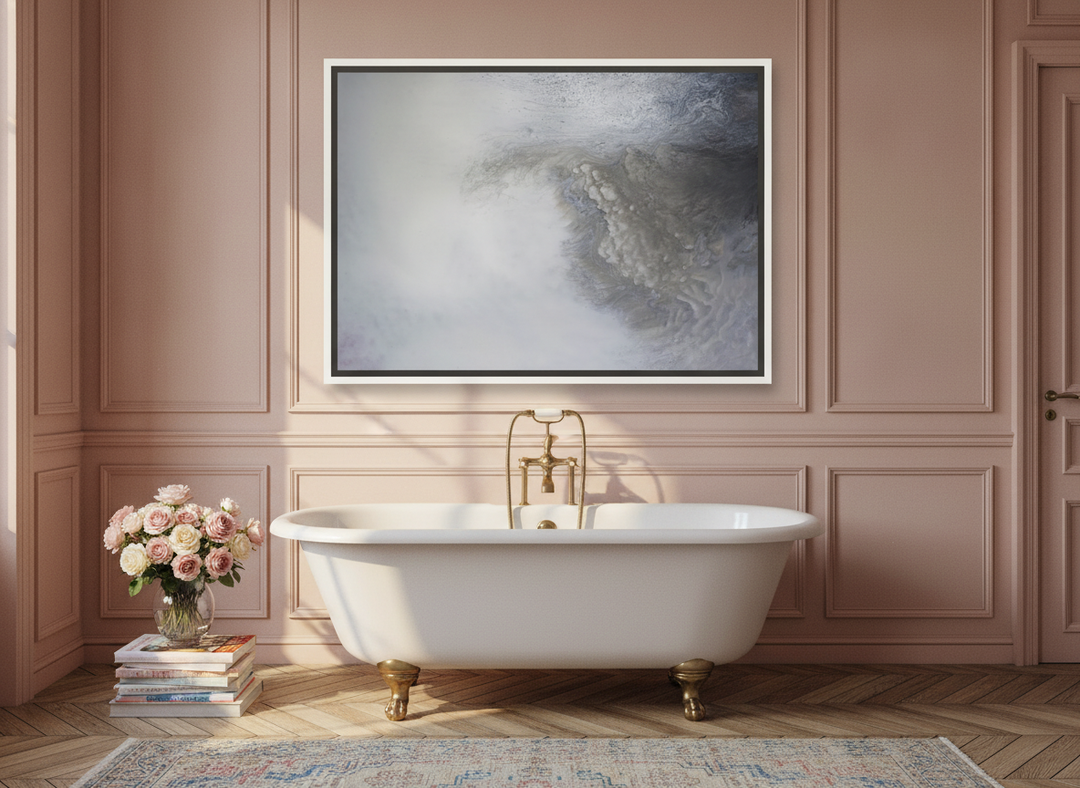 Canvas wall art with a white surround styled on the wall in a Parisian bathroom