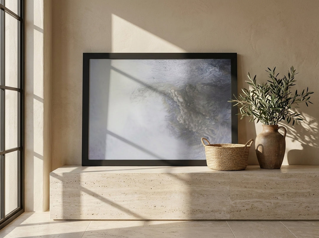 Modern wall art print standing on a console in a Mediterranean bathroom