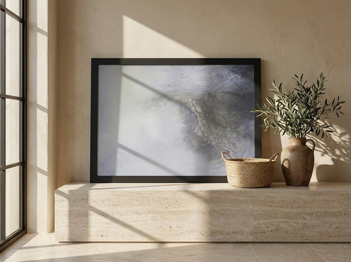 Modern wall art print standing on a console in a Mediterranean bathroom