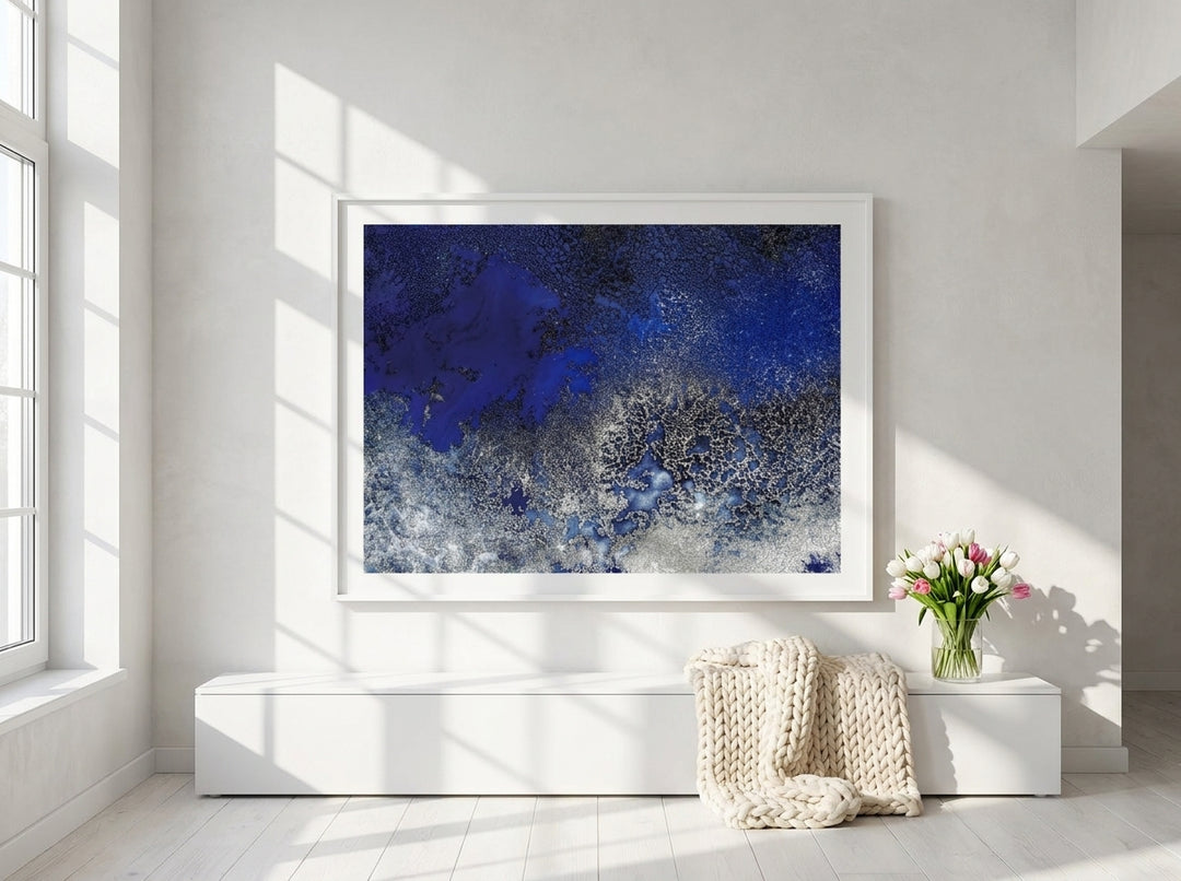 Oversized statement modern wall art print styled on the wall in a bright Scandinavian living room