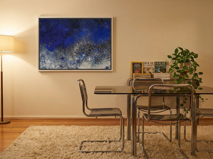 Canvas wall art with a white surround styled on the wall in a retro 70s dining room