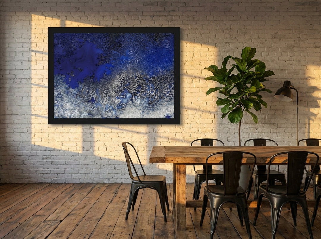 Modern wall art print styled on the wall in an industrial loft dining room