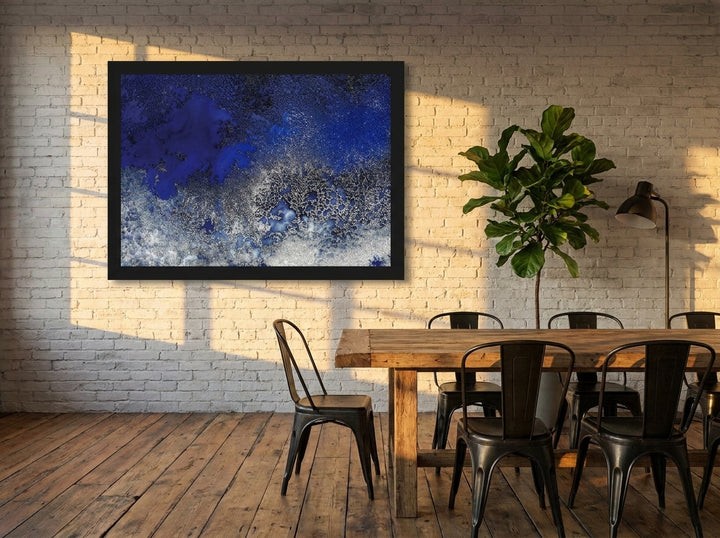 Modern wall art print styled on the wall in an industrial loft dining room