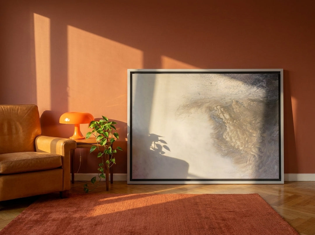 Canvas wall art with a silver leaf surround leaning against the wall in a retro 70s bedroom