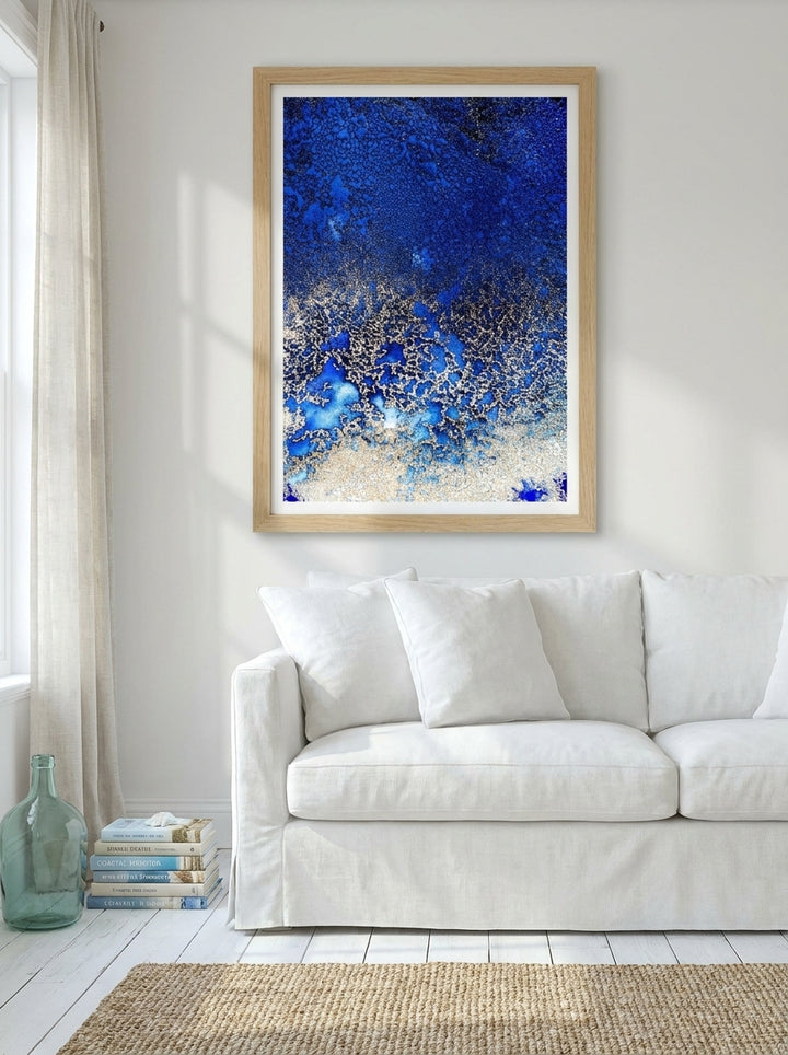 Modern wall art print styled on the wall in a coastal living room