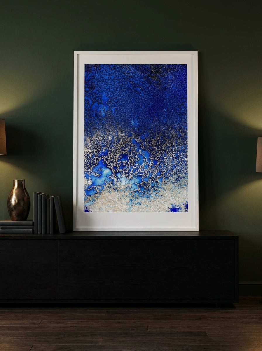 Modern wall art print standing on a console in a moody bedroom