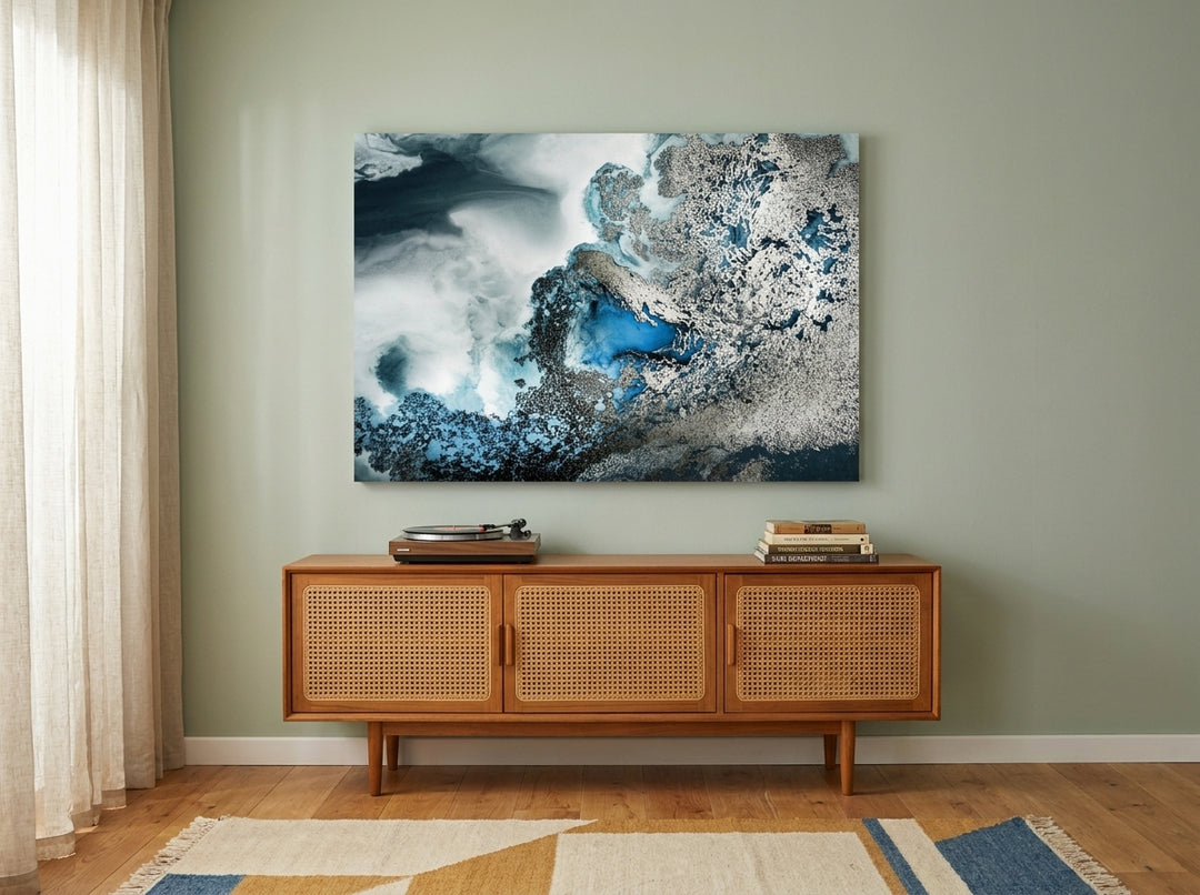 Stretched canvas wall art styled on the wall in a mid-century living room