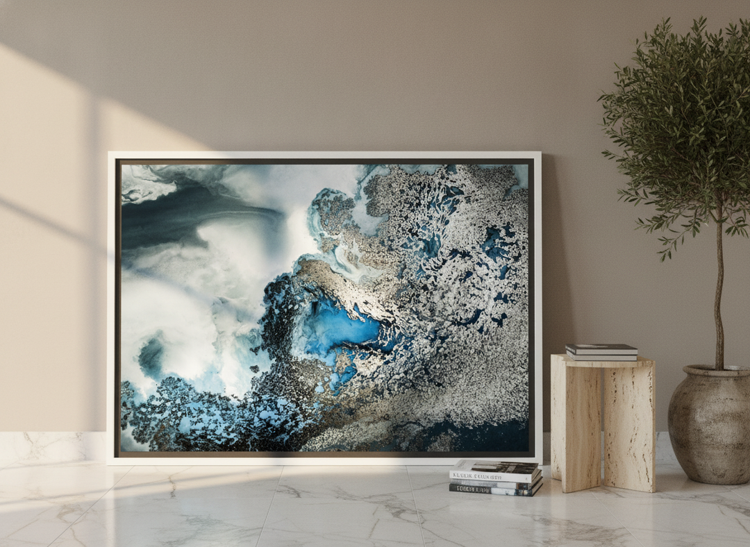 Oversized statement canvas wall art with a white surround leaning against the wall in a luxe dining room