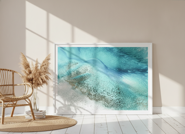 Modern wall art print leaning against the wall in a coastal bedroom