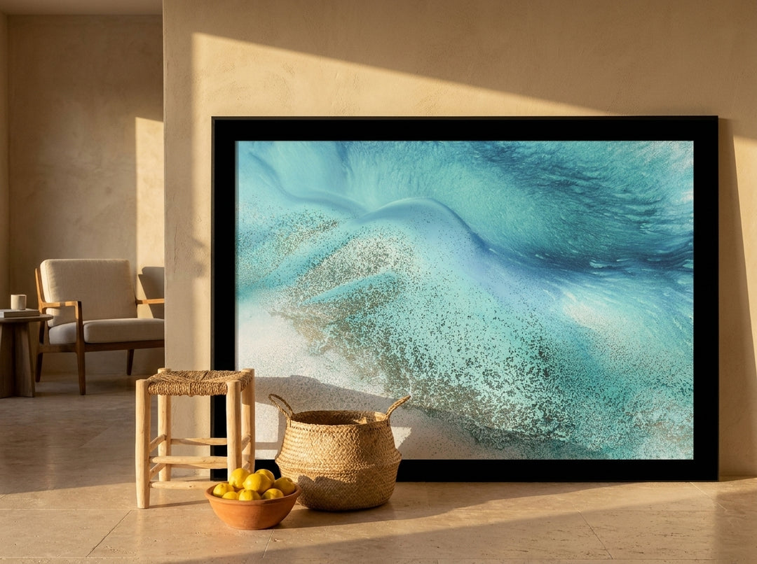 Oversized statement modern wall art print leaning against the wall in a Mediterranean living room