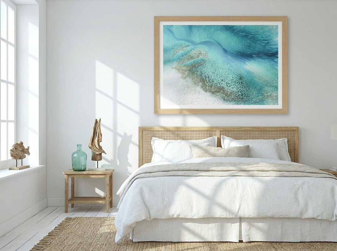 Modern wall art print styled on the wall in a coastal bedroom