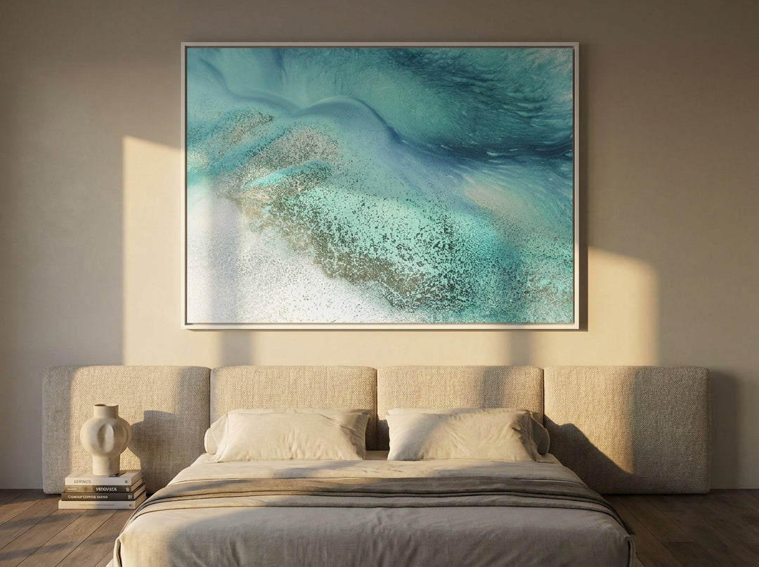 Oversized statement canvas wall art with a white surround styled on the wall in a luxe bedroom