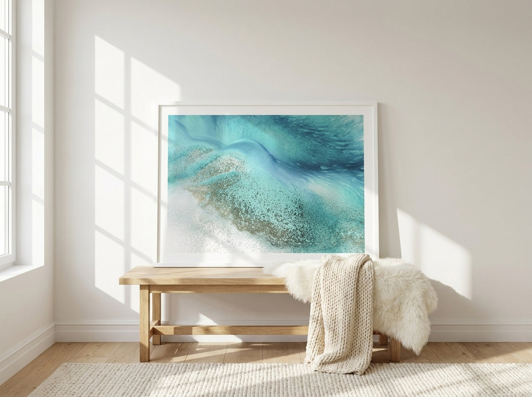 Modern wall art print standing on a bench in a bright Scandinavian bedroom