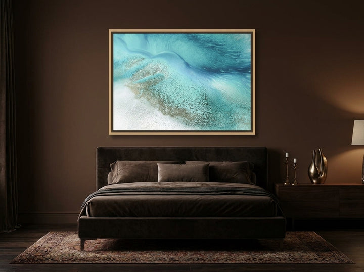 Canvas wall art with a natural timber surround styled on the wall in a moody bedroom