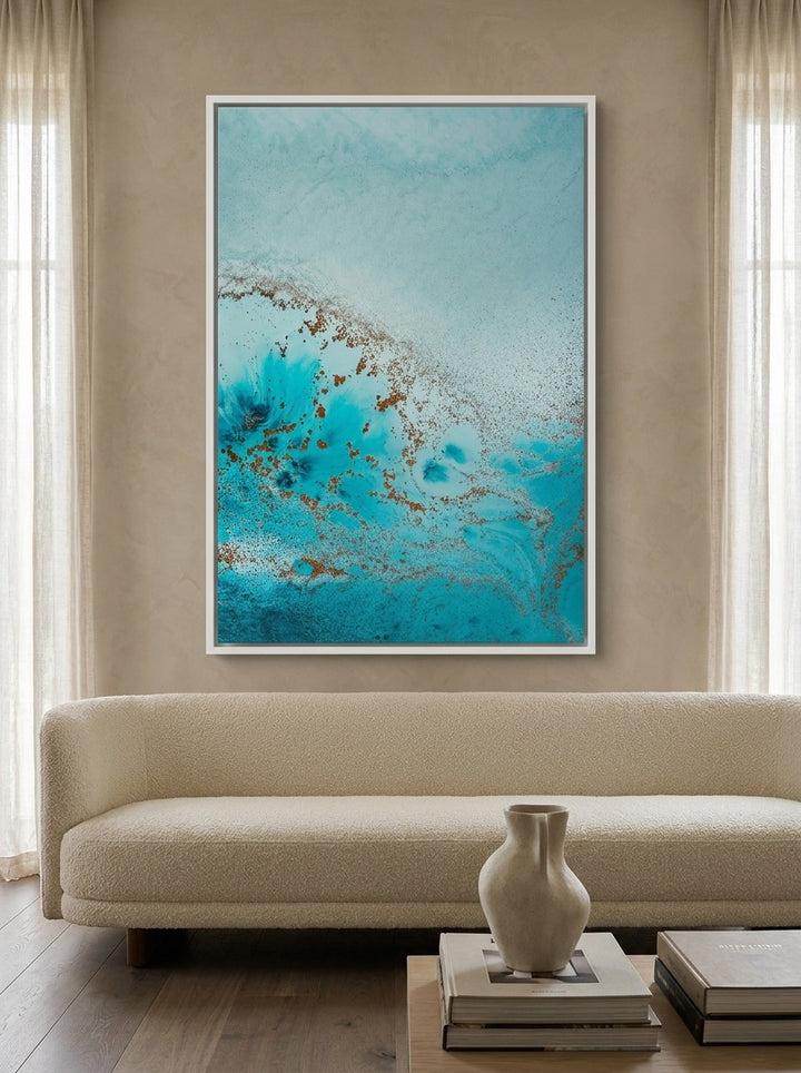 Oversized statement canvas wall art with a white surround styled on the wall in a luxe living room