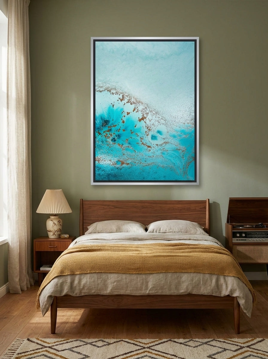 Canvas wall art with a silver leaf surround styled on the wall in a mid-century bedroom