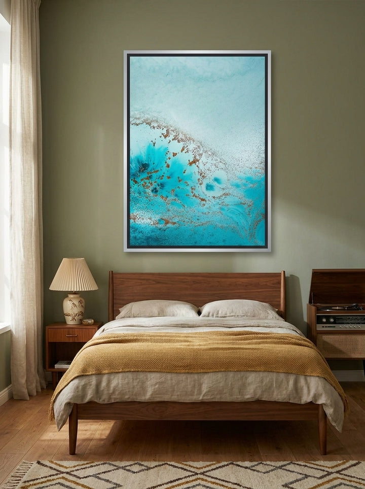 Canvas wall art with a silver leaf surround styled on the wall in a mid-century bedroom