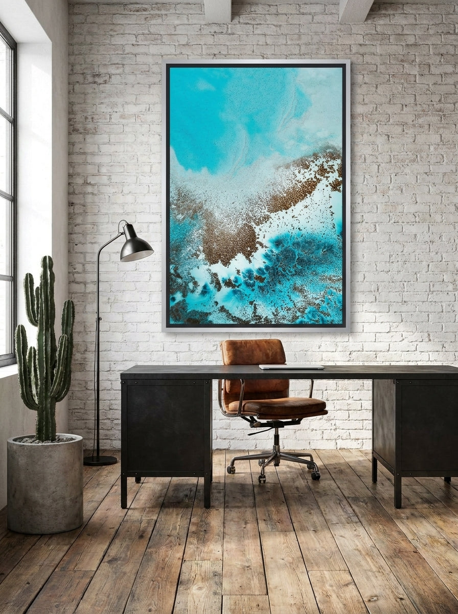 Canvas wall art with a silver leaf surround styled on the wall in an industrial loft home office