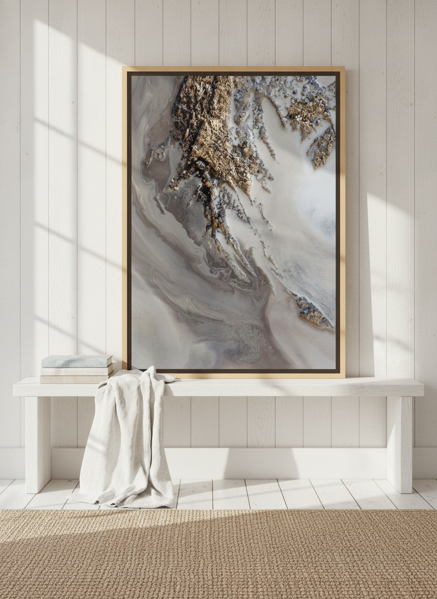Canvas wall art with a natural timber surround standing on a console in a coastal bedroom